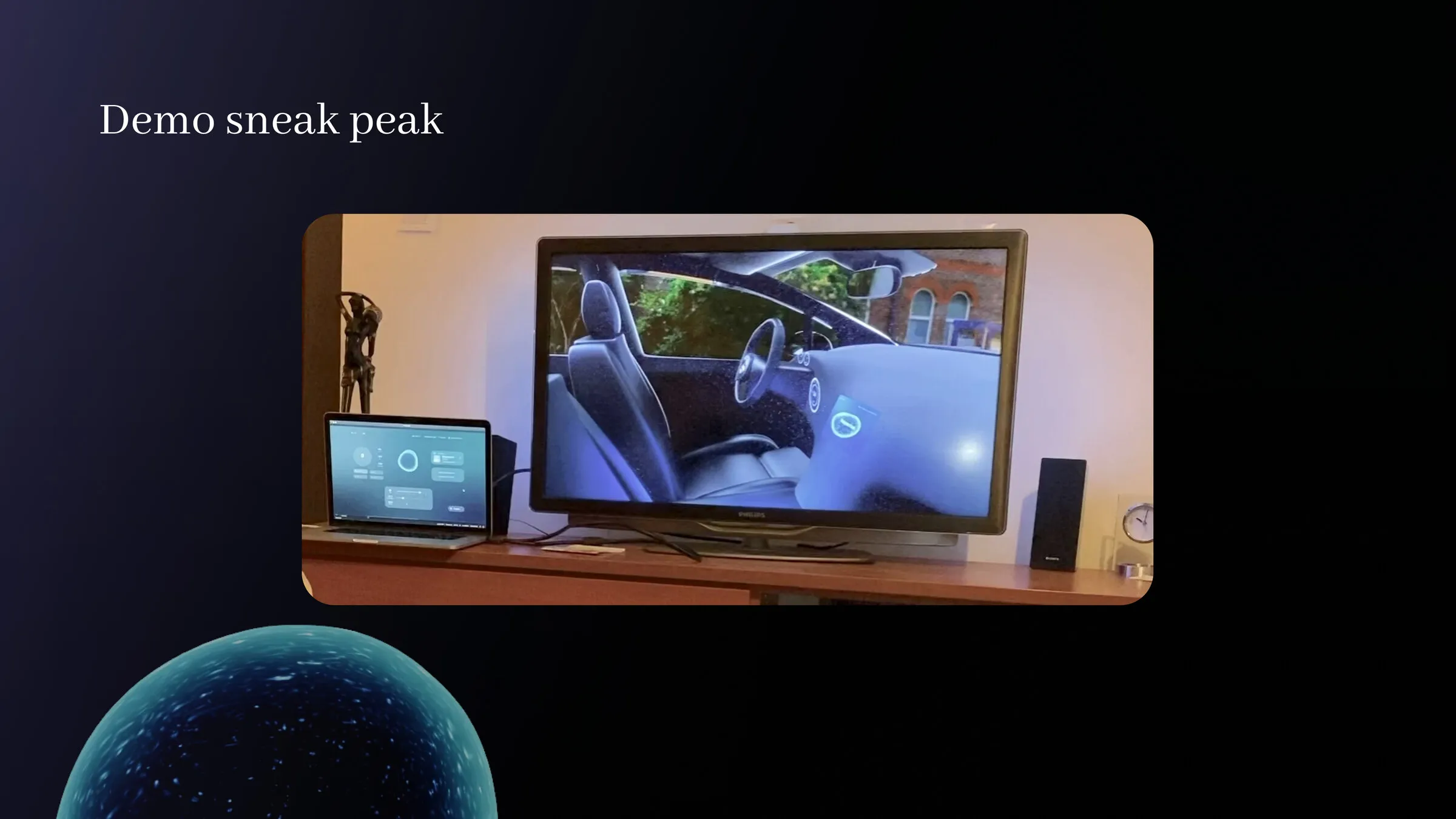 The hybrid demo set up on a desk: the rendered car interior on a television and the interface running on a laptop beside it